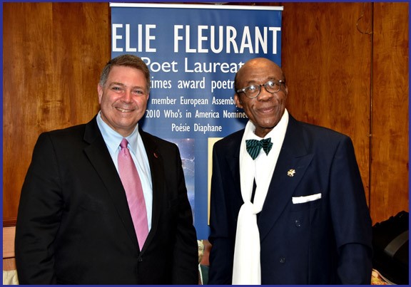 RHOADS GREETS POET LAUREATE ELIE FLUERANT